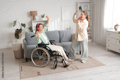 Young woman in wheelchair a...