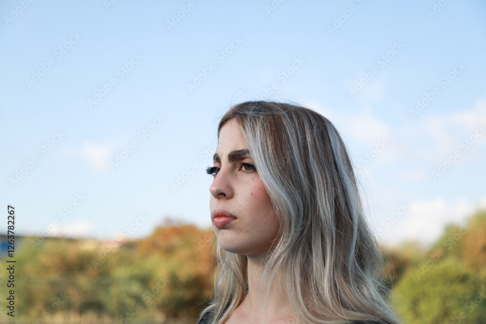 Fototapeta premium Woman In The Nature Standing Still And Looking 
