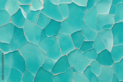 Mosaic tiles in vibrant turquoise color create an intricate, textured surface reminiscent of coastal themes photo