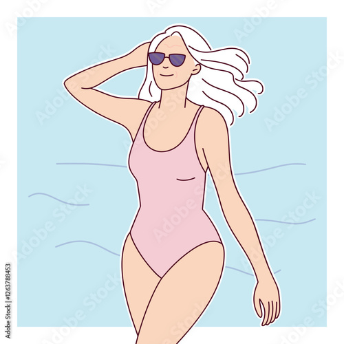 A smiling elderly white woman with long white hair wears sunglasses and a pink swimsuit while walking along the beach.