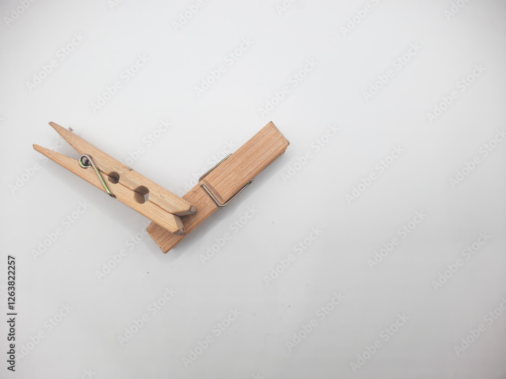 Clothesline clip made of wood with white background Clothesline clip made of wood with white background