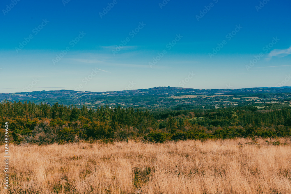 Landscape with view of crops and beautiful mountains with blue sky on the French Way. Stage Portomarin - Palas de Rei. Spain. Landscape with view of crops and beautiful mountains with blue sky on the French Way. Stage Portomarin - Palas de Rei. Spain.