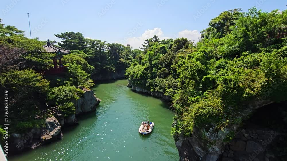 Jeju, South Korea - Aug 2, 2024 : Crossing Dragons' Playground - Jeju's Enchanting Yongyeon Cloud Bridge Jeju, South Korea - Aug 2, 2024 : Crossing Dragons' Playground - Jeju's Enchanting Yongyeon Cloud Bridge