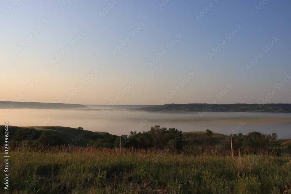 Obraz premium Foggy Morning at Sunrise in the Valley.