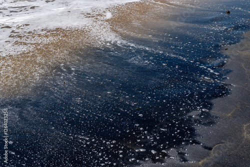 Waves washing onto a black sand beach. Playa Negra, Vieques Puerto Rico. photo