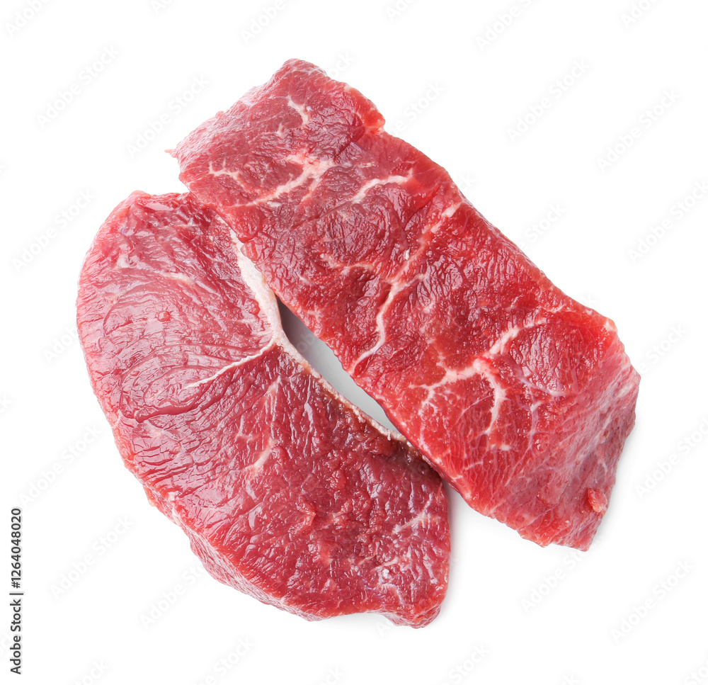 Fototapeta premium Pieces of raw beef meat isolated on white, top view
