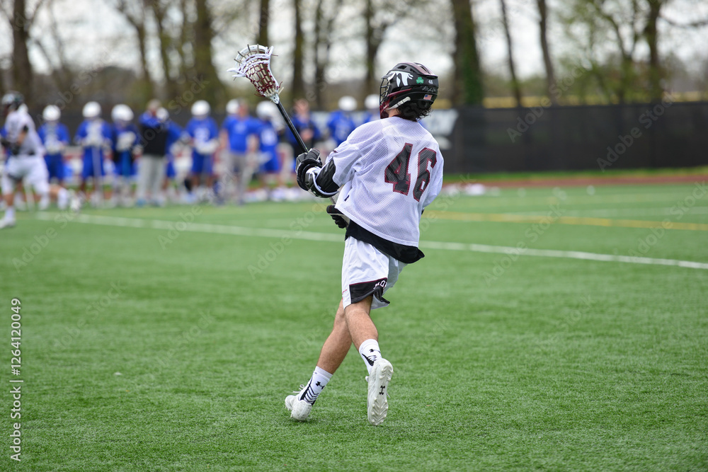 Foto Boy playing lacrosse