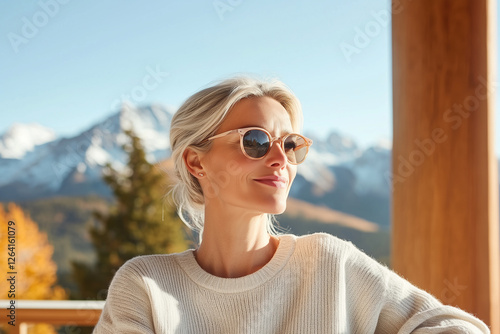 Mature woman embracing the beauty of autumn landscapes
