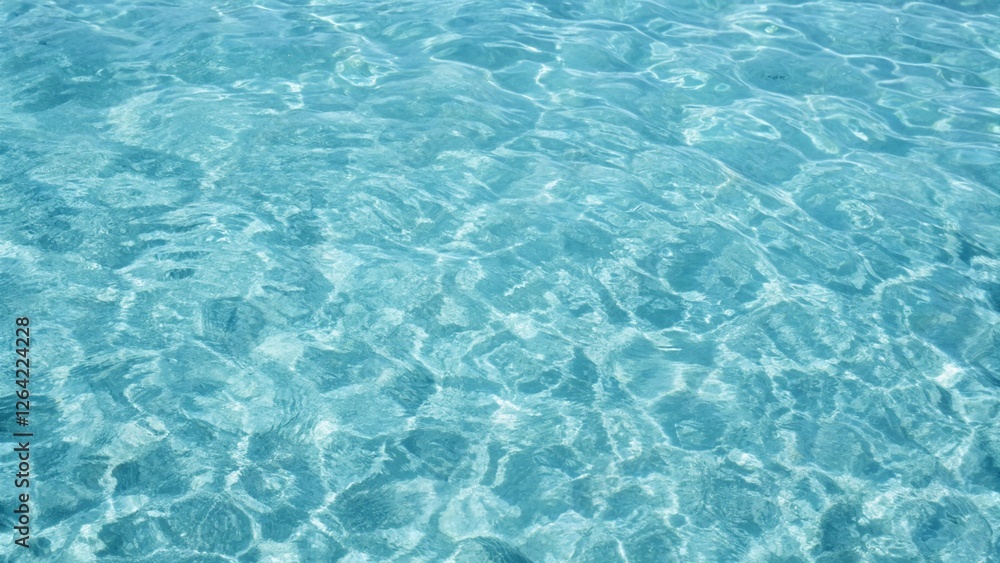 Blue ripped seawater in a swimming pool. Crystal clear ocean lagoon bay turquoise blue azure water surface, closeup natural environment. Tropical Mediterranean beach water background Blue ripped seawater in a swimming pool. Crystal clear ocean lagoon bay turquoise blue azure water surface, closeup natural environment. Tropical Mediterranean beach water background