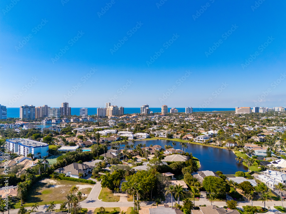Obraz premium Naples Florida aerial photo coastal neighborhoods with homes and beach front condominiums
