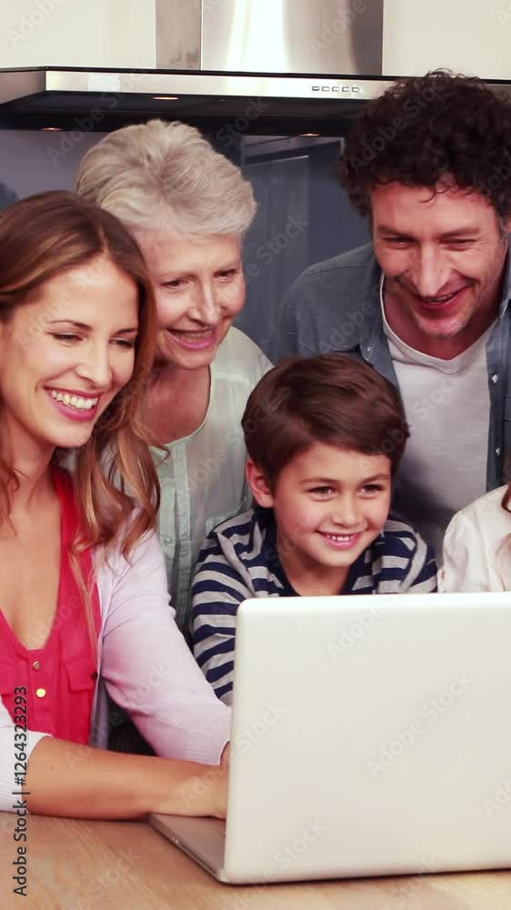 Happy family using laptop together Happy family using laptop together