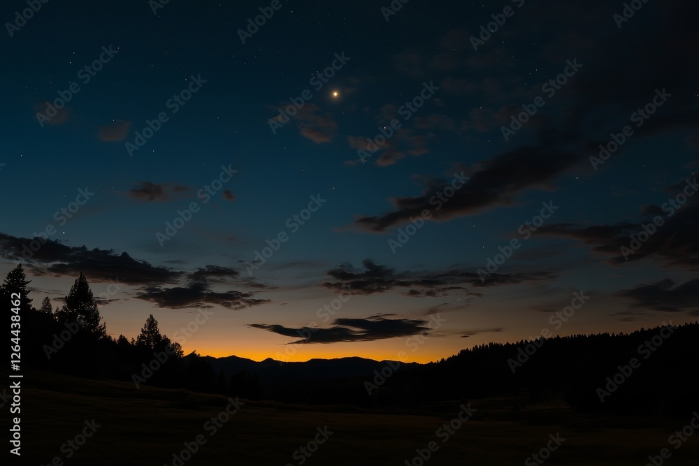 Night sky over silhouetted mountains and forest at sunset with a bright star. Night sky over silhouetted mountains and forest at sunset with a bright star.