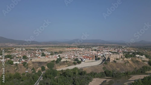 Wallpaper Mural Orbital drone flight of the town of Escalona where we see the Alberche river, a sloping access with a large medieval wall that closed the town and its 15th century castle-palace, there are mountains Torontodigital.ca