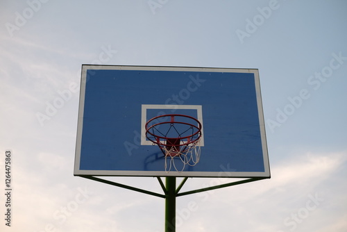 photo of a basketball hoop with a blue backboard
