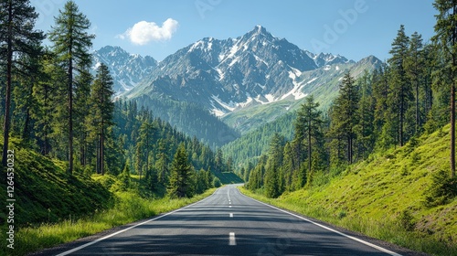 Scenic mountain road surrounded by lush greenery and towering peaks under a clear blue sky