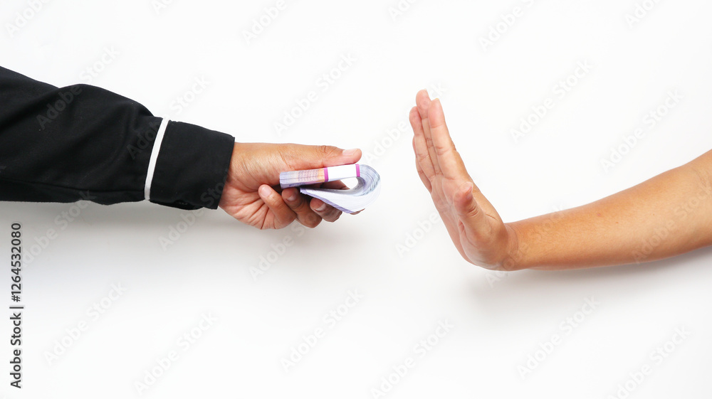 A portrait of businessman refusing money, Indonesian rupiah bills - anti-bribery and corruption concepts. white background A portrait of businessman refusing money, Indonesian rupiah bills - anti-bribery and corruption concepts. white background