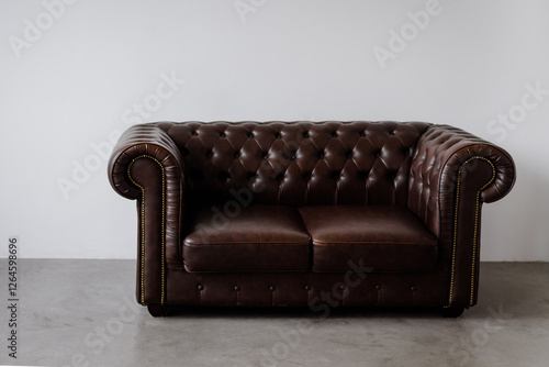 Brown leather office sofa in retro style on flat in loft design 