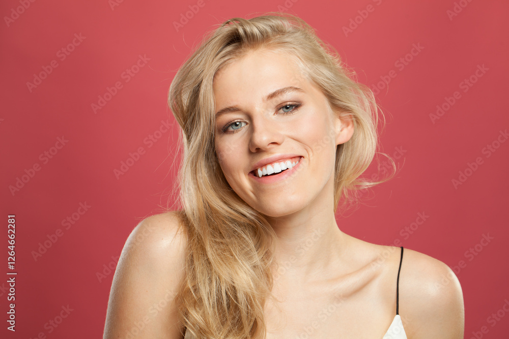 Joyful blond model woman portrait. Beautiful face with healthy clear skin, long shiny hair and cute smile Joyful blond model woman portrait. Beautiful face with healthy clear skin, long shiny hair and cute smile