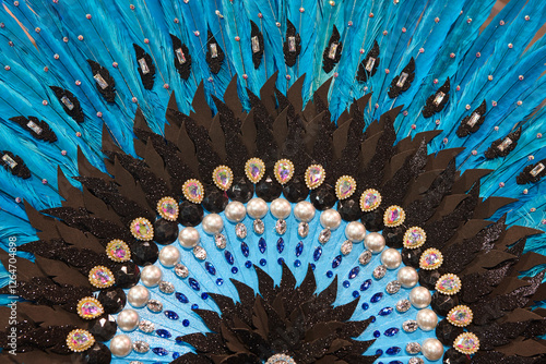 Handcrafted fan detail made with blue feathers and jewelry. Carnival photo