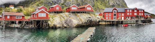 wooden house on red stilts typical of the villages in the archipelago of Lofo...