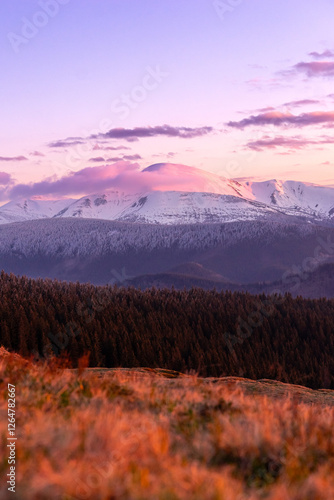 landscape view sunset or sunrise in the winter mountain and snowy peak, travel outdoor, beauty of nature, postcard or poster