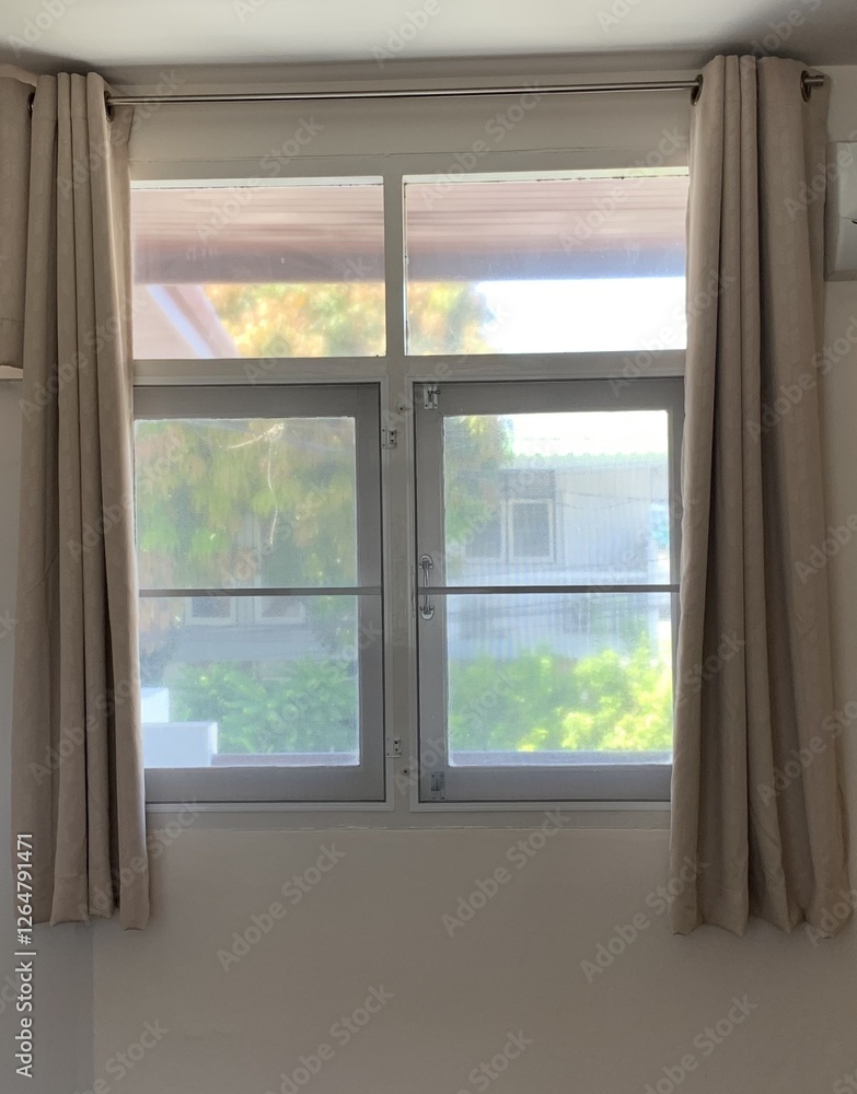 white window with curtain, Empty beige wall room in sunlight from window, blowing white sheer, brown blackout curtain, white window with curtain, Empty beige wall room in sunlight from window, blowing white sheer, brown blackout curtain,