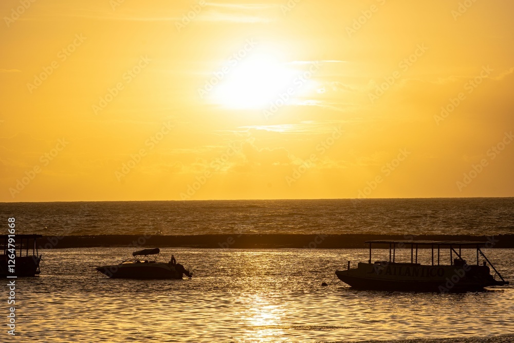 Sunset over ocean with boat silhouettes. Sunset over ocean with boat silhouettes.