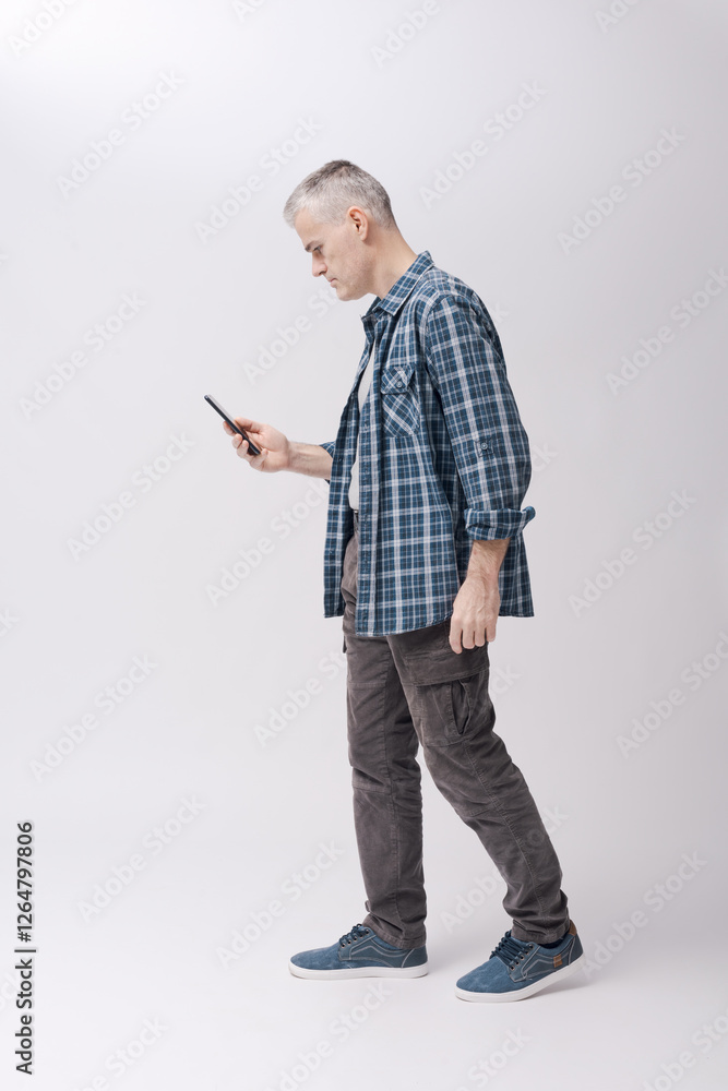 Man holding his smartphone and checking social media contents Man holding his smartphone and checking social media contents