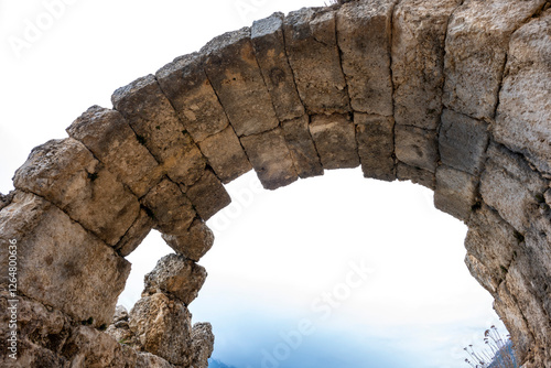 Remains of gymnasium in acnient Lycian city Arycanda. Ancient city on mountain near Aykiricay village.Well preserved semi-circular theater of Arycanda, ancient Lycian city in Antalya photo