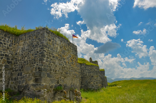 Armenian flag on walls of ancient Lori fortress (Lori Berd, Armenia)