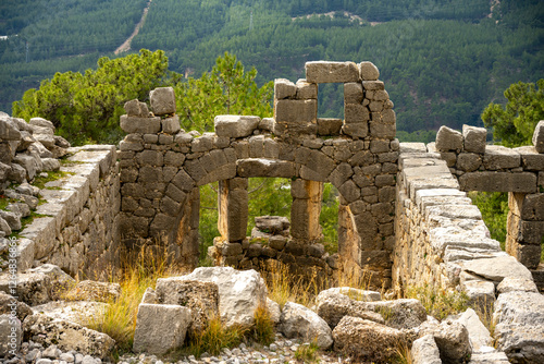 Remains of gymnasium in acnient Lycian city Arycanda. Ancient city on mountain near Aykiricay village.Well preserved semi-circular theater of Arycanda, ancient Lycian city in Antalya, Turkey.
 photo