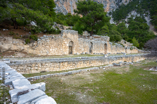 Remains of gymnasium in acnient Lycian city Arycanda. Ancient city on mountain near Aykiricay village.Well preserved semi-circular theater of Arycanda, ancient Lycian city in Antalya, Turkey.
 photo