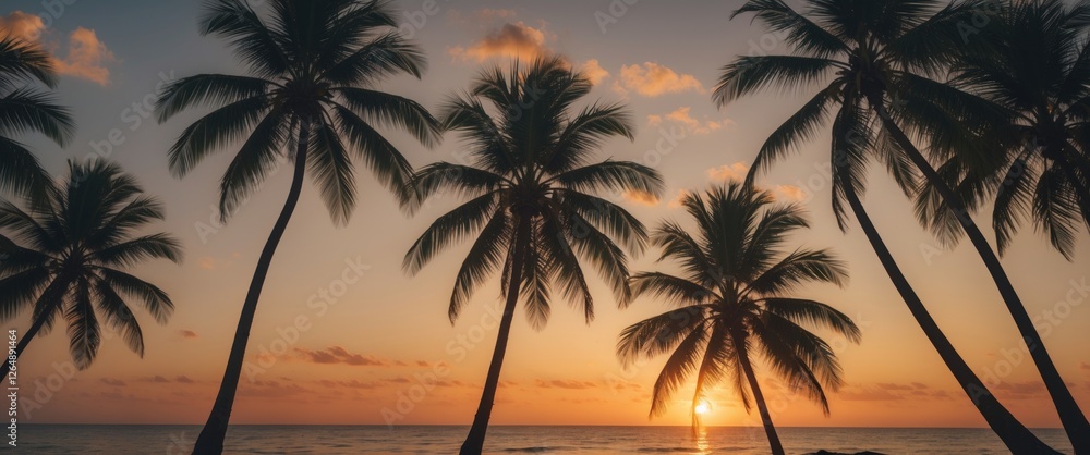 Silhouette of palm trees against tropical sunset with ocean view and colorful sky Copy Space Silhouette of palm trees against tropical sunset with ocean view and colorful sky Copy Space