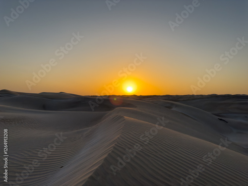 Sunset at the white sands desert also known as Sugar Dunes in Sultanate of Oman