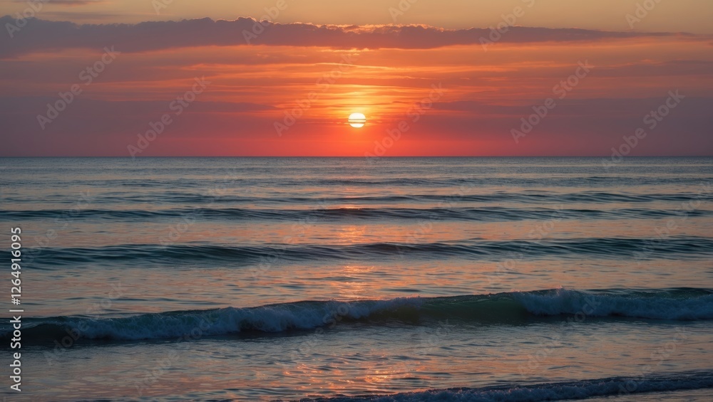 Sunset over calm ocean waves with vibrant colors in the sky and reflection on water Copy Space Sunset over calm ocean waves with vibrant colors in the sky and reflection on water Copy Space