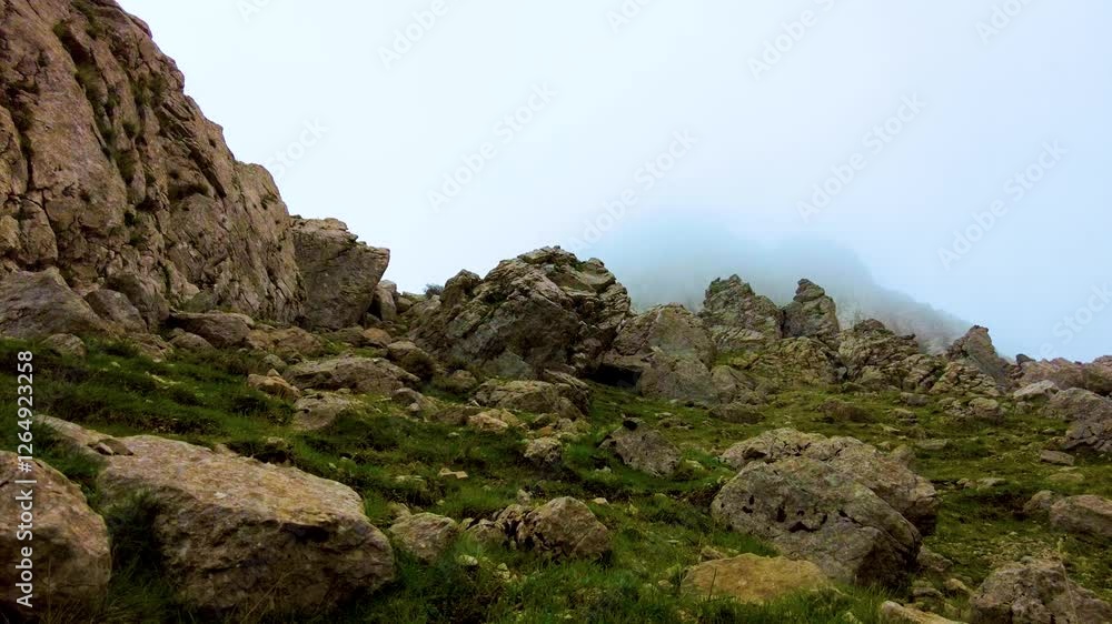 Gulmim lake at the top of the Djurdjura mountain Algeria Kabylie with the passage of clouds