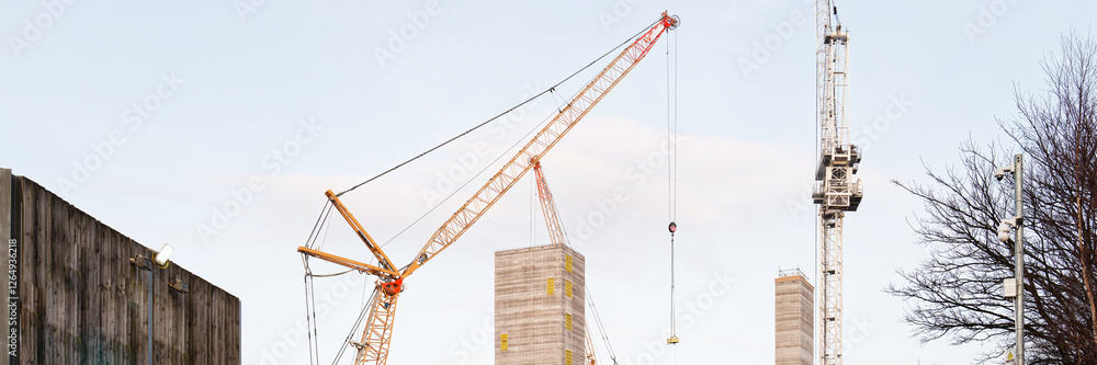 Tower crane high in sky at construction site Tower crane high in sky at construction site