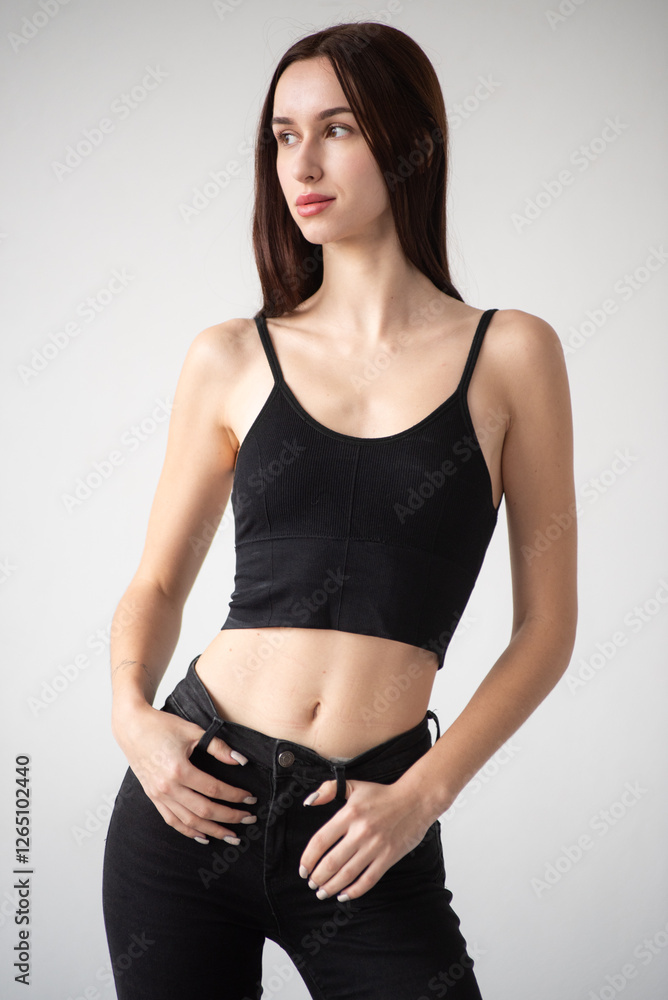 Naklejka premium Professional model test shoot for agency submission. Natural beauty, minimal makeup, black bikini, clean background, confident poses. Perfect for portfolios, castings, and fashion industry needs