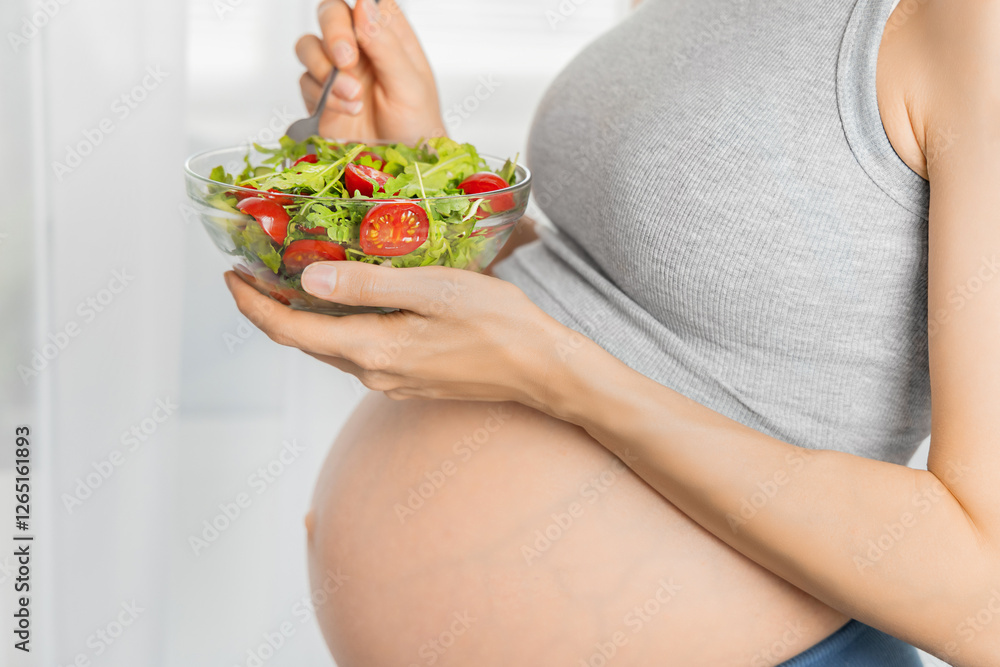 pregnant woman with plate of fresh vegetables. healthy eating concept pregnant woman with plate of fresh vegetables. healthy eating concept