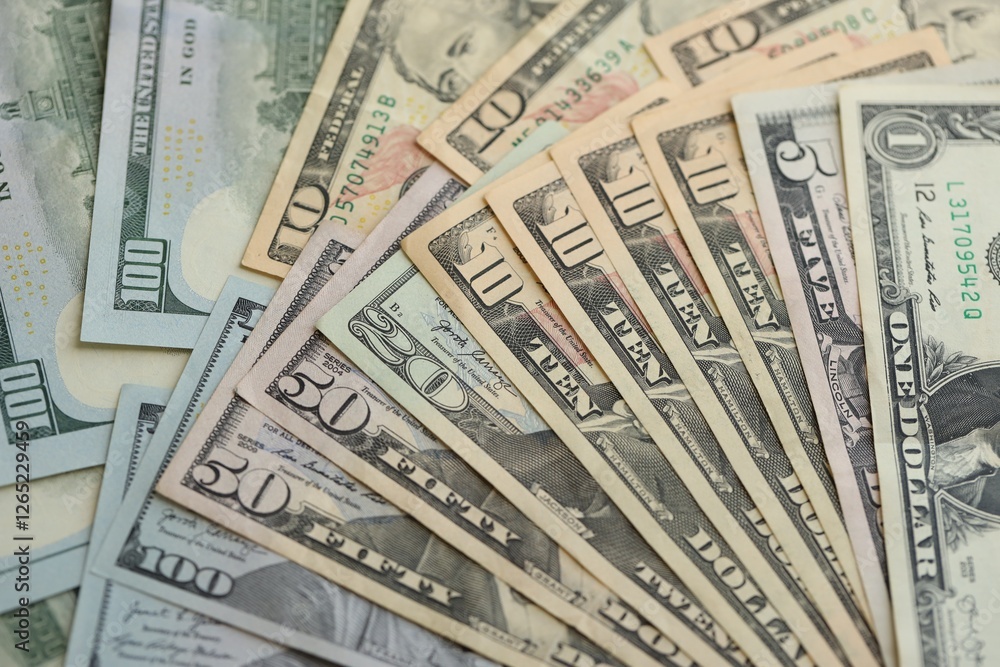 Many dollar bills banknotes in different denominations Many dollar bills banknotes in different denominations