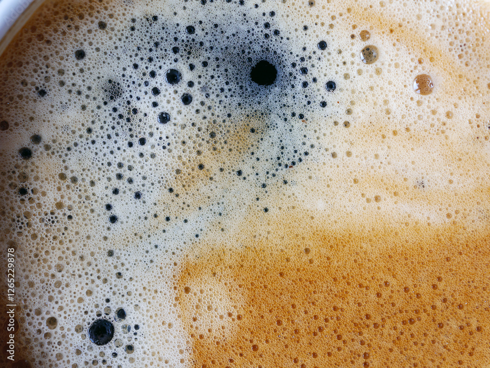 Coffee cream texture of fragrant coffee background bubbles with foam. macro coffee crema Coffee cream texture of fragrant coffee background bubbles with foam. macro coffee crema