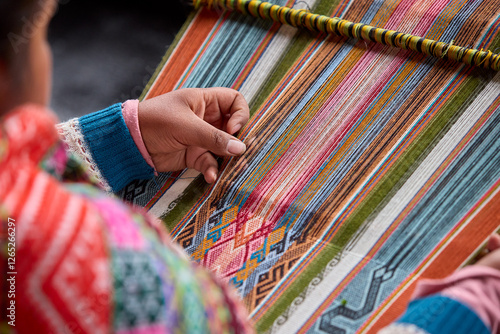 Tableau sur toile The hands of a weaver hold generations of skill, patience, and creativity, turning simple strands into works of art