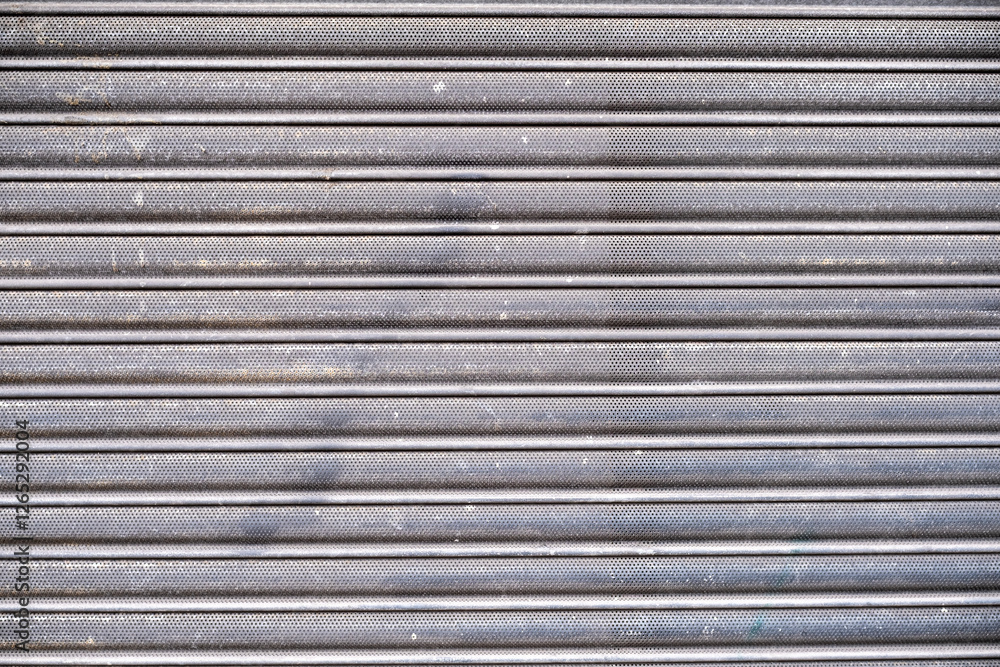 Closed shutters in front of shop Closed shutters in front of shop