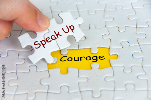 Fotografija Speak Up and Courage text on jigsaw puzzle