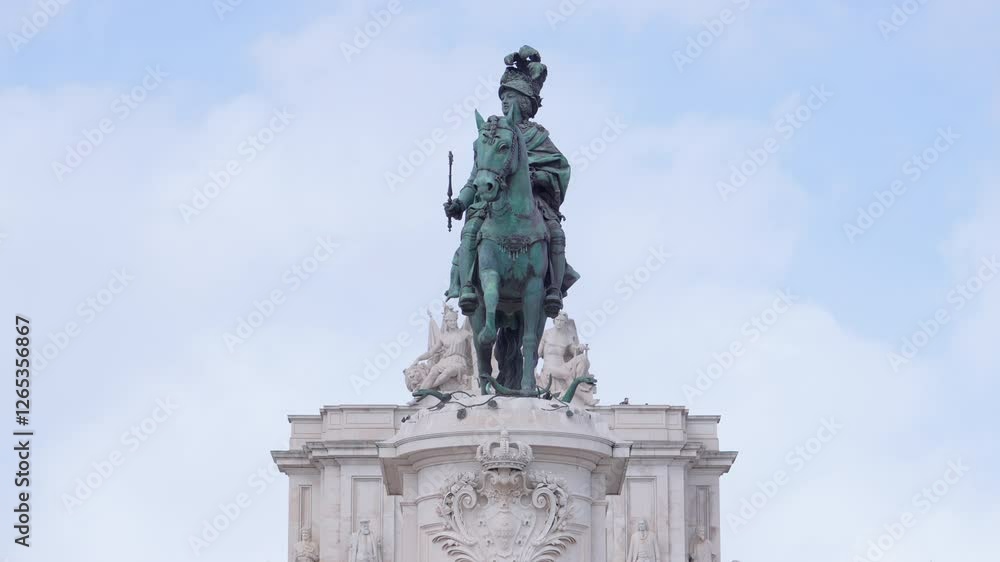 Bronze statue of a knight on horseback in an urban landscape surrounded by historic architecture and a clear sky Bronze statue of a knight on horseback in an urban landscape surrounded by historic architecture and a clear sky