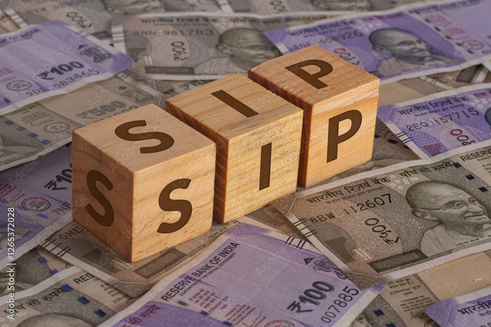 SIP Word on Wooden Cubes with Indian Currency Background | Financial Growth Concept SIP Word on Wooden Cubes with Indian Currency Background | Financial Growth Concept