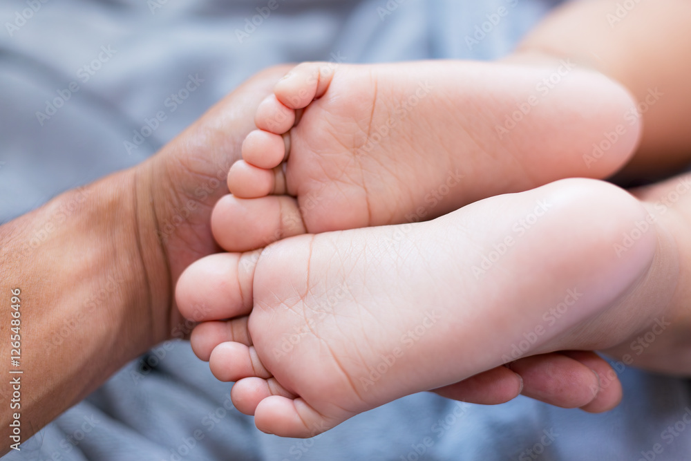 Baby feet,Mother holding Baby Feet in Hands. Legs Newborn in female parents Hand. Small children's Feet in the Mom Palm. Close-up. Little Toes of Child and Woman Hands of Happy Parent. Baby feet,Mother holding Baby Feet in Hands. Legs Newborn in female parents Hand. Small children's Feet in the Mom Palm. Close-up. Little Toes of Child and Woman Hands of Happy Parent.