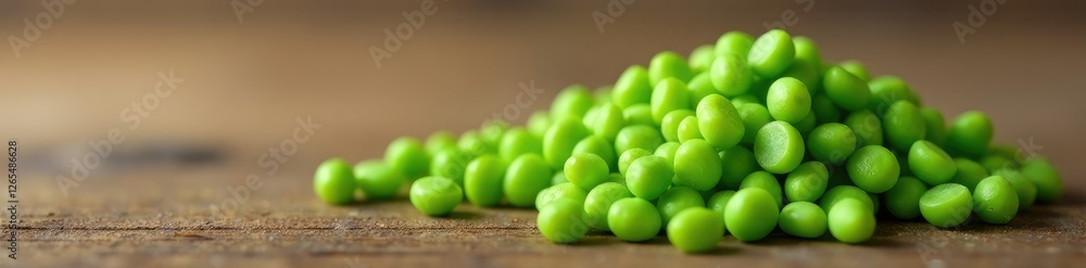 Fresh green jojoba seeds on a wooden background, monochromatic, desert plant