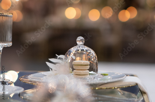 macaroons under glass cloche on fancy wedding table setting