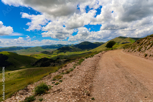 Paesaggio del Parco Nazionale dei Monti Sibillini, tra Marche e Umbria, in una soleggiata giornata di inzio estate, Italia photo